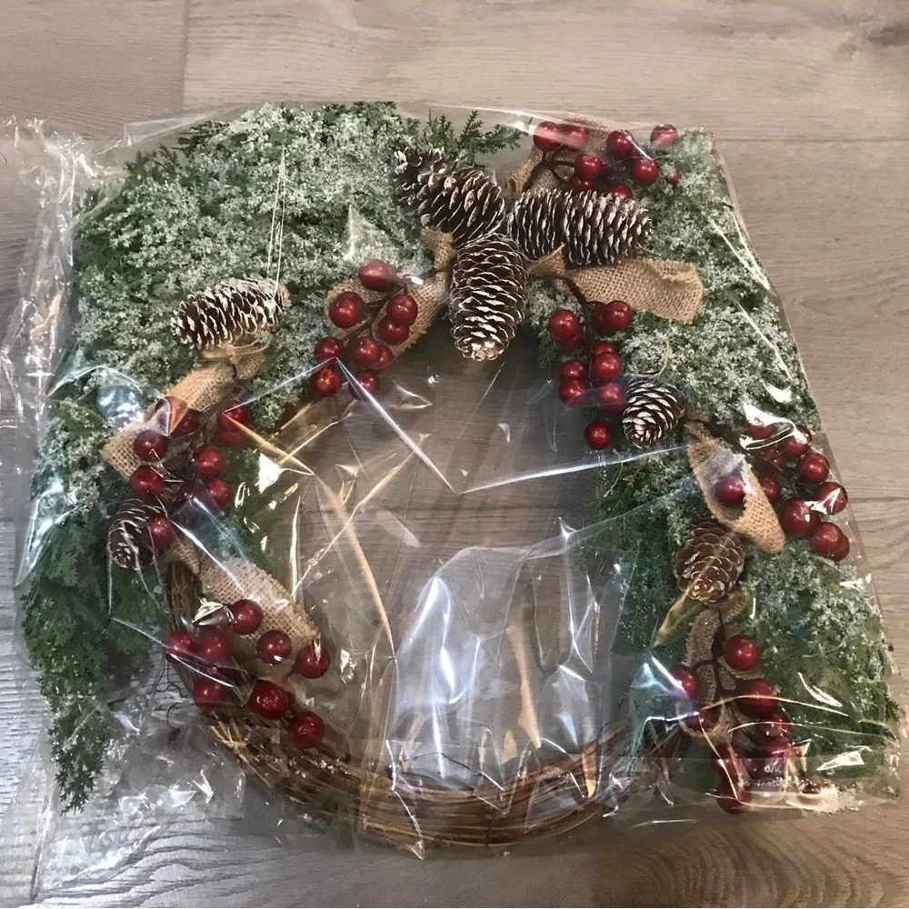 Festive Holiday Wreath with Red Berries, Pinecones and Artificial Snow
